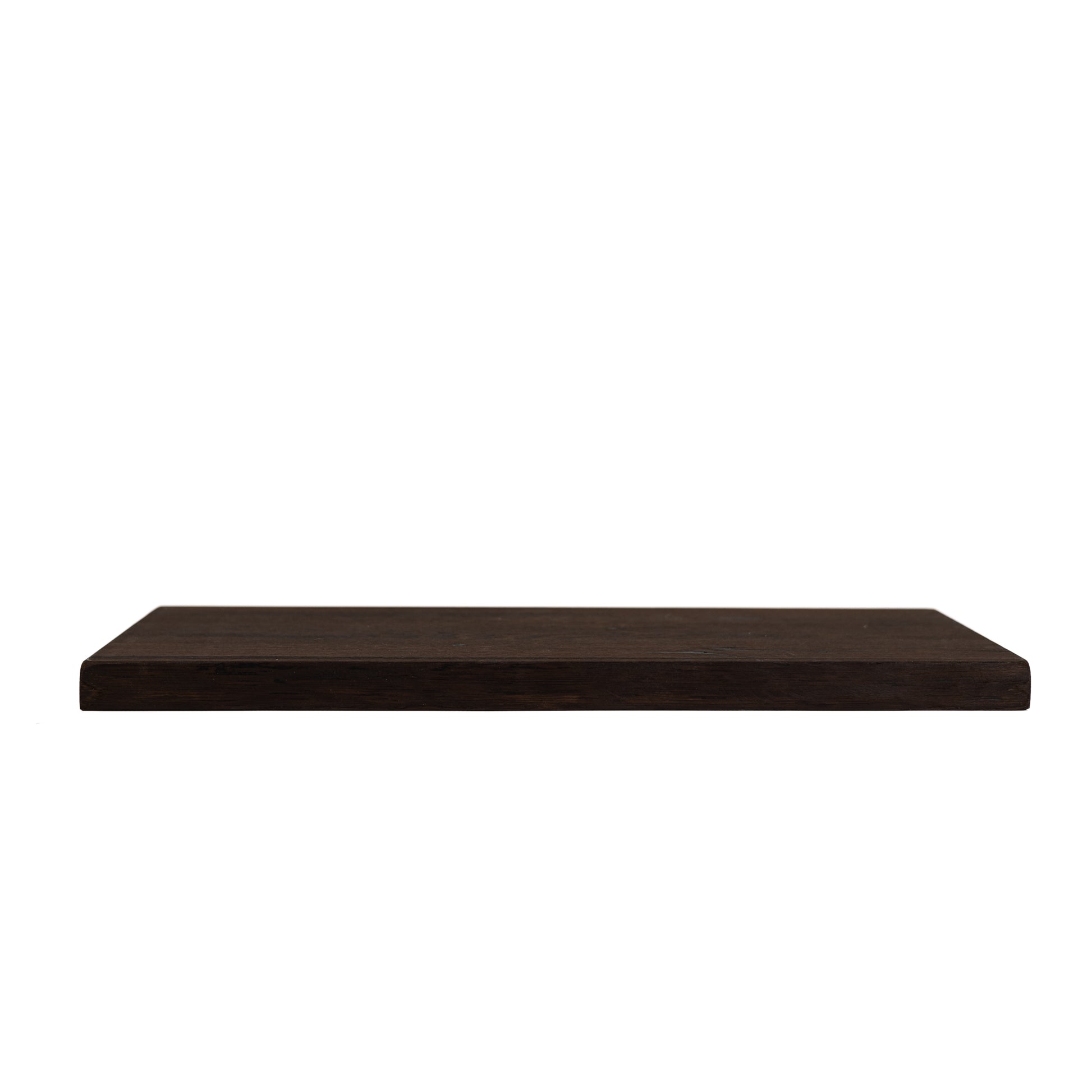 Side view of solid dark oak floating shelf showing thickness