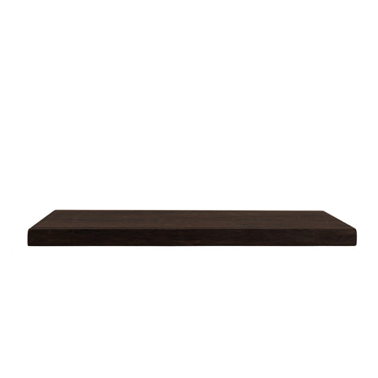 Side view of solid dark oak floating shelf showing thickness