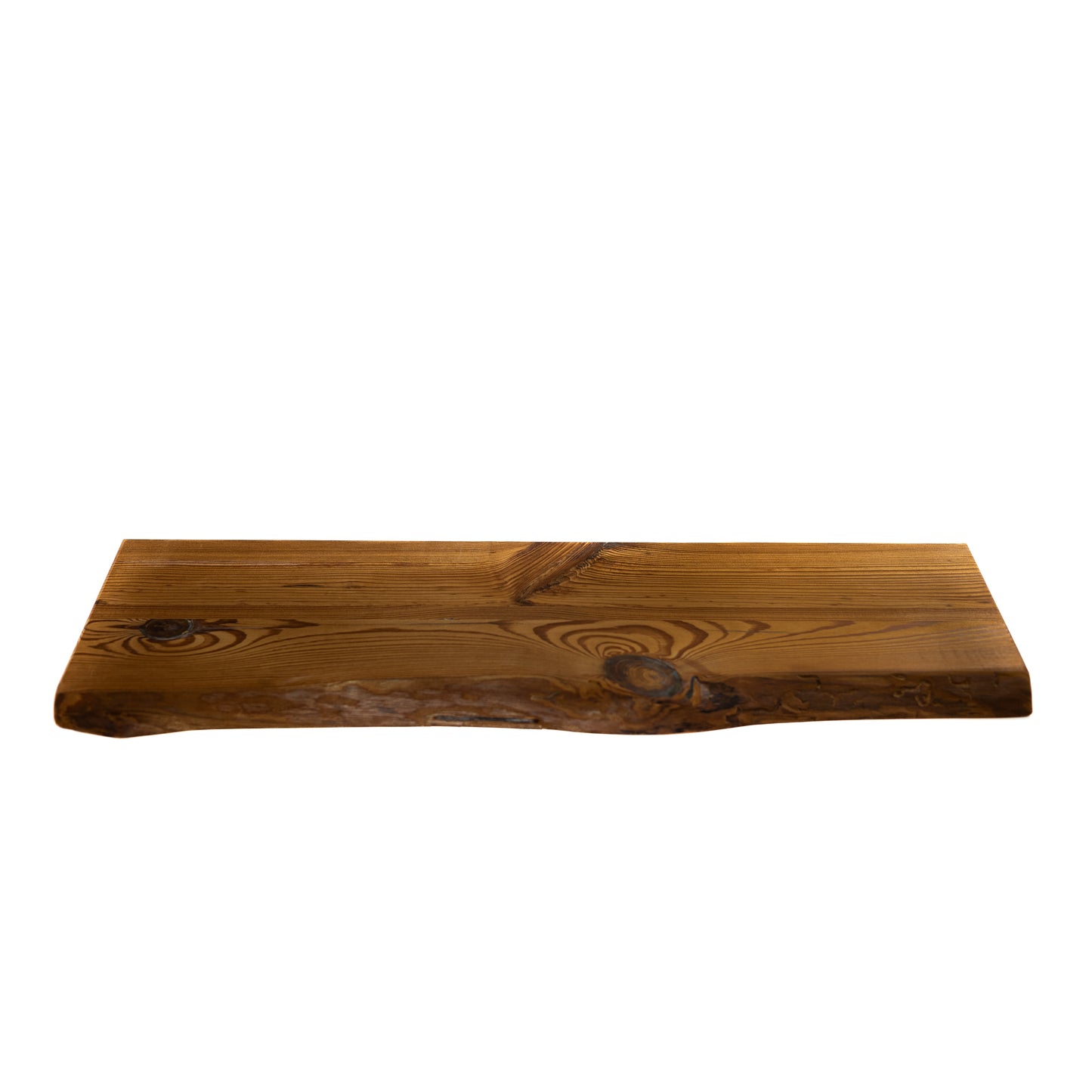 Wooden floating shelf with a natural finish on a white background
